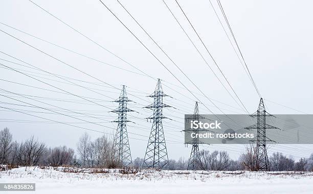 Electricity Pylons And Power Lines In The Winter Day Stock Photo - Download Image Now