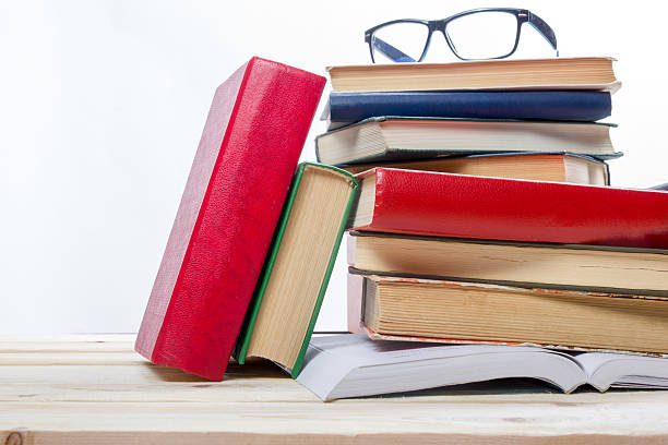 istock Stack of colorful books on wooden table. Back to school. 484836322