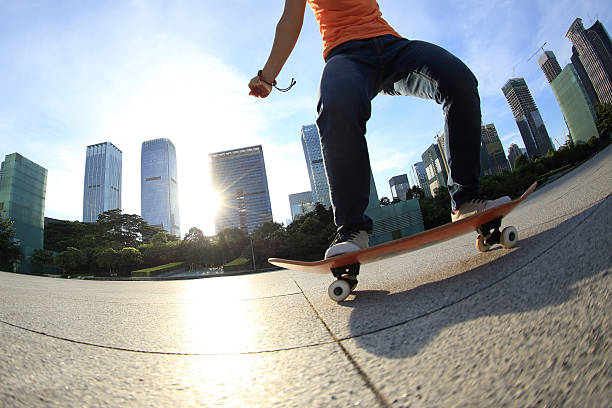 istock skateboarder skateboarding at sunrise city 484836760