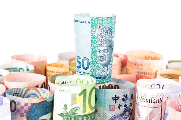 istock Pile of rolled-up currency notes with Malaysia Ringgit on top 484838300