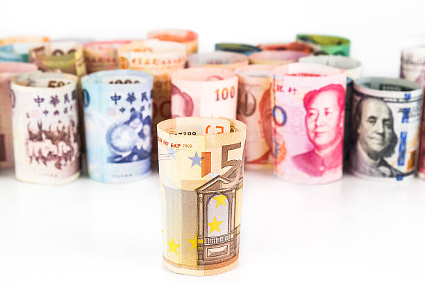 istock Pile of rolled-up currency notes with EURO in front 484838304
