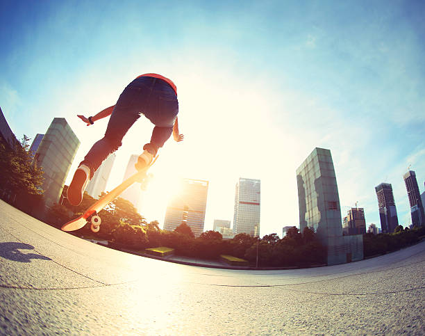 istock skateboarder skateboarding at sunrise city 484838492