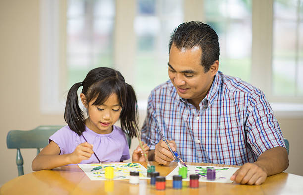 istock Father homeschooling young daughter 484841274