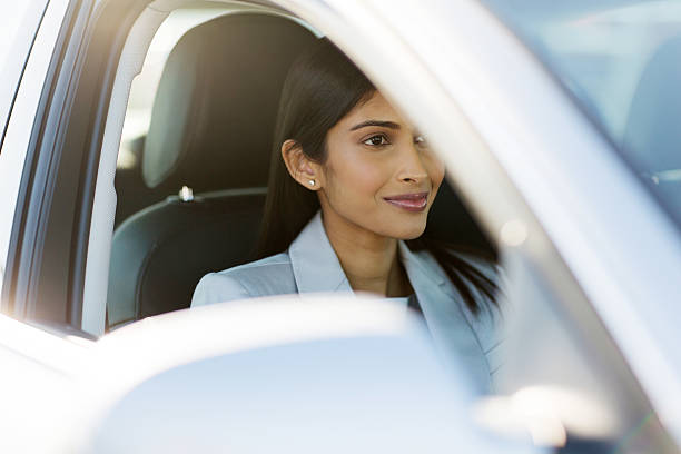 istock indian businesswoman drive to work 484841378
