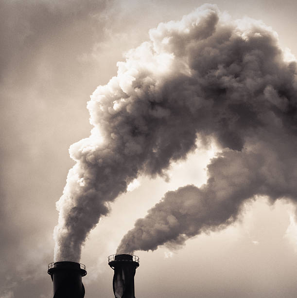 istock Smoke billowing from industrial chimneys 484841450