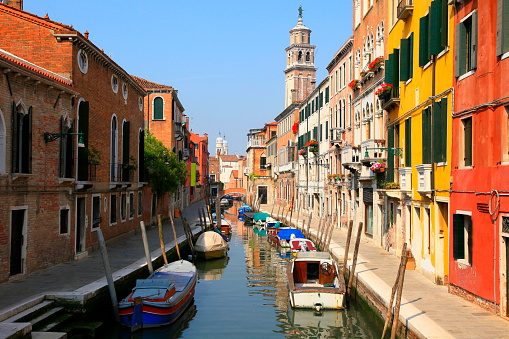 Venetian Canal, boats and residential architecture, Venice, Italy