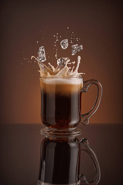 istock Splash of  ice coffee drink on a brown background. 484842114