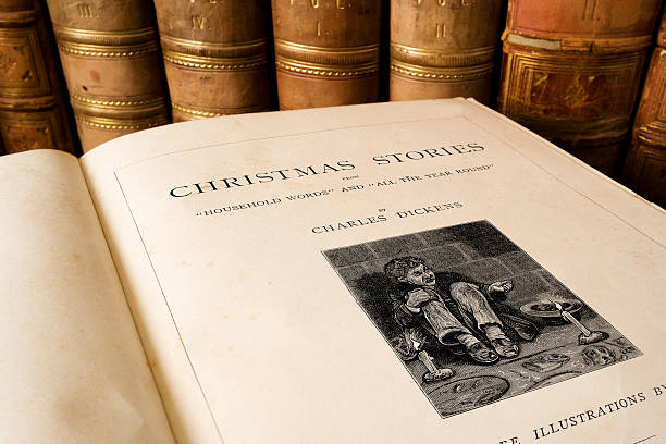 Charles Dickens - Christmas Stories Antique book of Charles Dickens the Christmas Stories charles dickens stock pictures, royalty-free photos & images