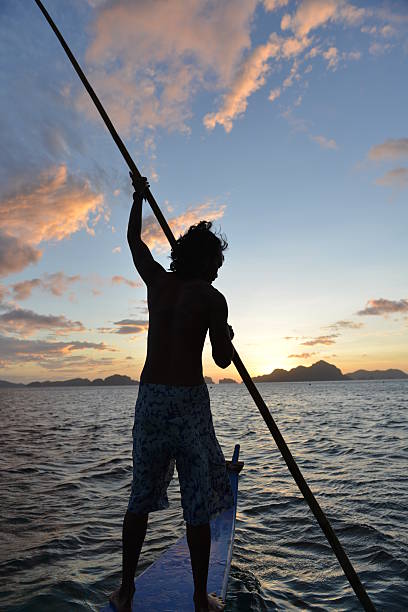 philippino banca のアウトリガーでは、伝統的なボートをフィリピン - mode of transport boracay mindanao palawan ストックフォトと画像