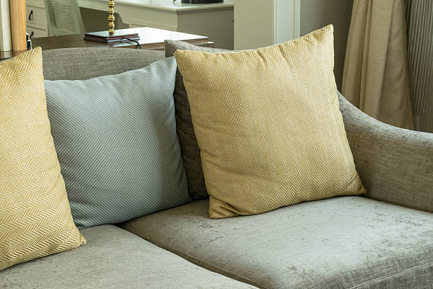 istock living room interior with yellow and gray pillows on sofa 484845996