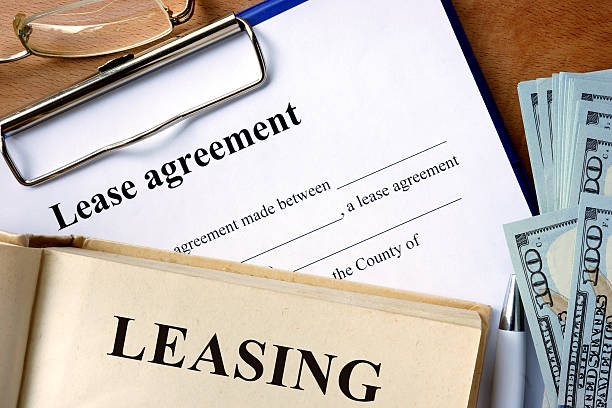 istock Book with word leasing,  lease agreement form. 484846152
