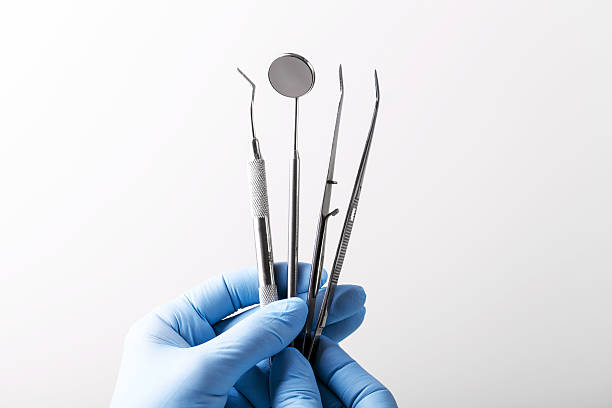 dental Instruments dental Instruments, equipment, hygiene, dental, health, mirror, surgery tooth in hand stock pictures, royalty-free photos & images