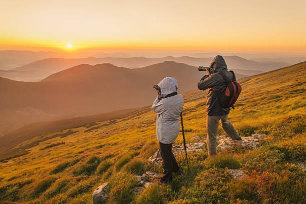istock Photographers takes a sunset in the mountains 484850796
