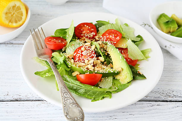 istock salad with slices of avocado and tomatoes 484855714
