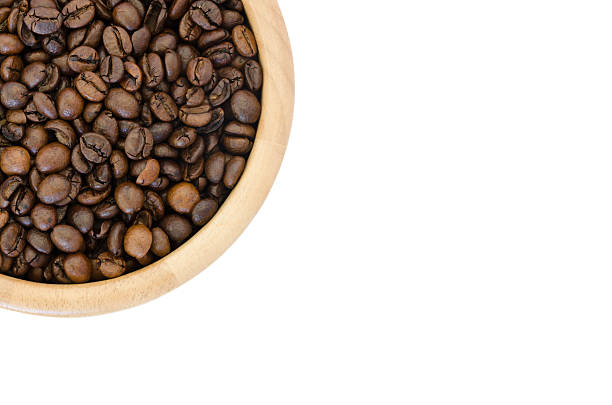 istock coffee beans in a bowl isolated on white background 484856132