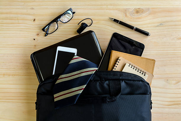istock Businessman accessories and notebook bag on desk 484856182