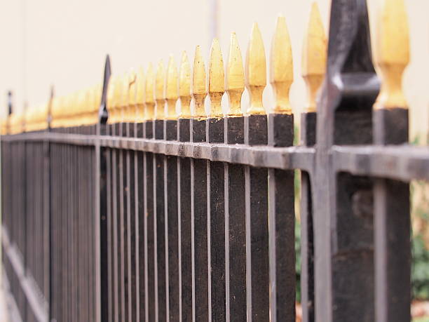 istock ron fence black with golden tips 484858840