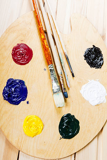 istock Palette with oil paint and brushes. 484864322