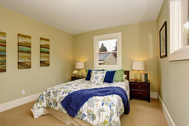istock Modern bedroom with green and blue interior decor. 484867130