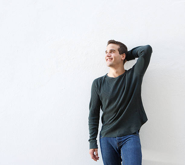 istock Cheerful young man standing against white background 484868158