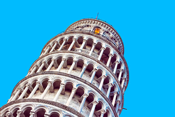 Leaning Tower of Pisa Pisa tower detail on blue sky background. Photo with some copy space. pisa leaning tower of pisa tower famous place stock pictures, royalty-free photos & images