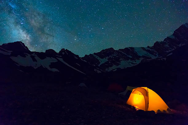 istock Night mountain landscape with illuminated tent 484868992
