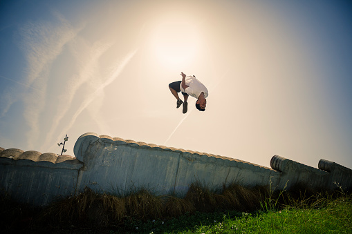 Young man practicing parkour in the city