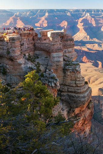Grand Canyon National Park, Arizona, USA - September 12th, 2012: Tourists on plateau enjoying the view of the Grand Canyon from Mather Point, soon after rain. Nikom D3x