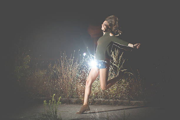 istock Jumping fashion woman 484874340