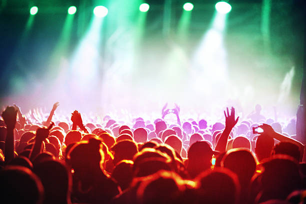 istock People at concert party. 484874464