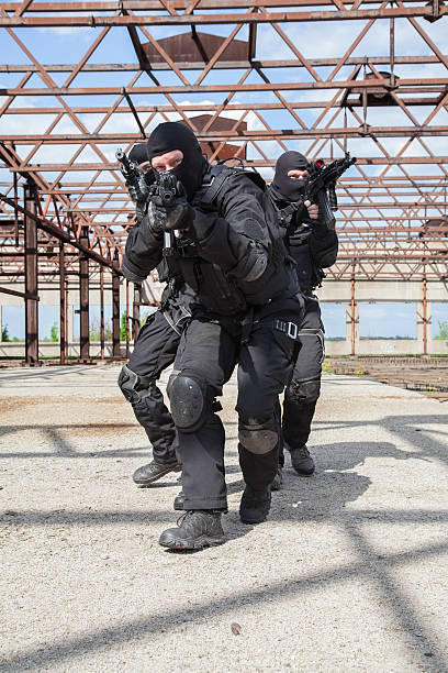 Special forces in action Special forces operators in black uniform in action spetsnaz stock pictures, royalty-free photos & images