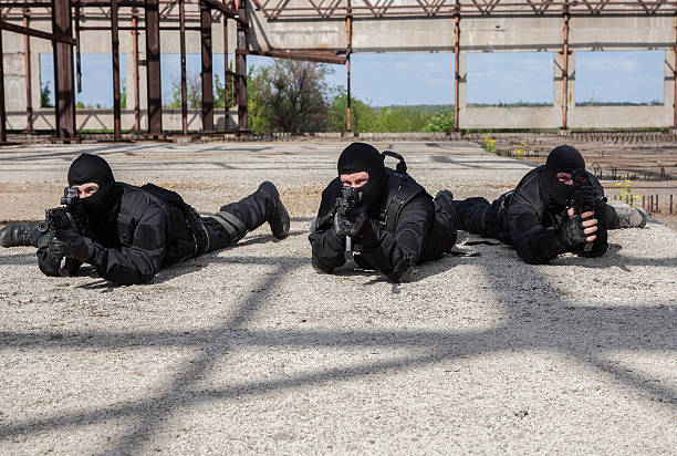 Special forces in action Special forces operators in black uniform in action spetsnaz stock pictures, royalty-free photos & images