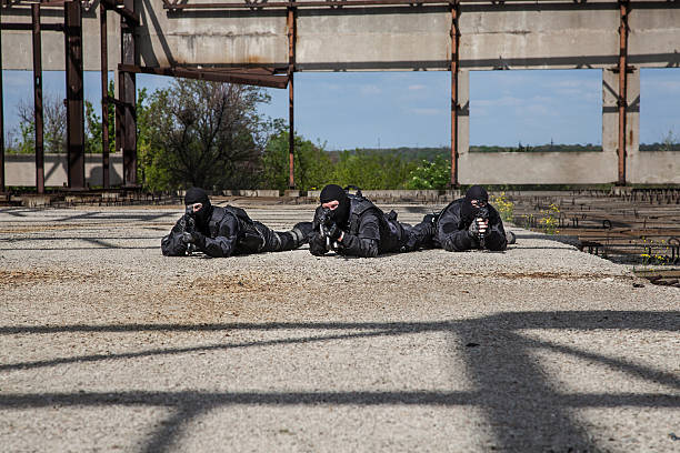 Special forces in action Special forces operators in black uniform in action spetsnaz stock pictures, royalty-free photos & images
