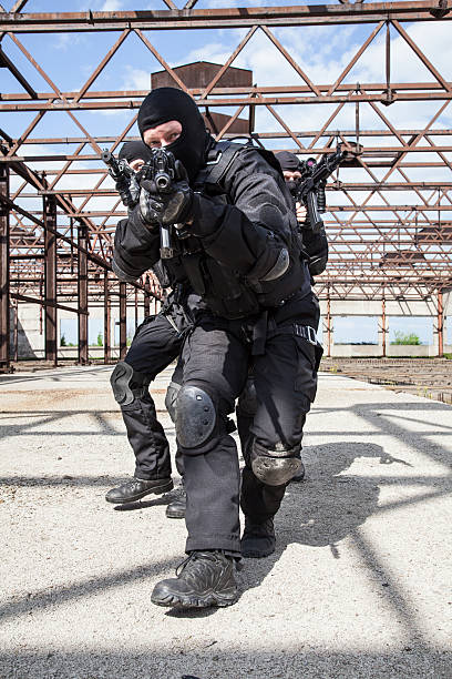 Special forces in action Special forces operators in black uniform in action spetsnaz stock pictures, royalty-free photos & images