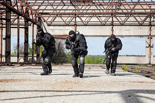 Special forces in action Special forces operators in black uniform in action spetsnaz stock pictures, royalty-free photos & images