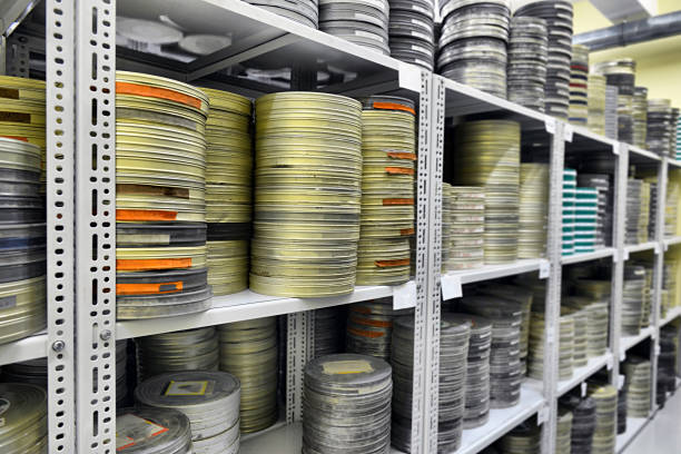 Old  camera and film reels. Image styled with a grainy film look. 