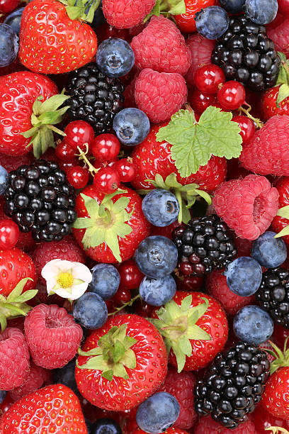istock Fruits berries background with strawberries, blueberries and red currants 484897616