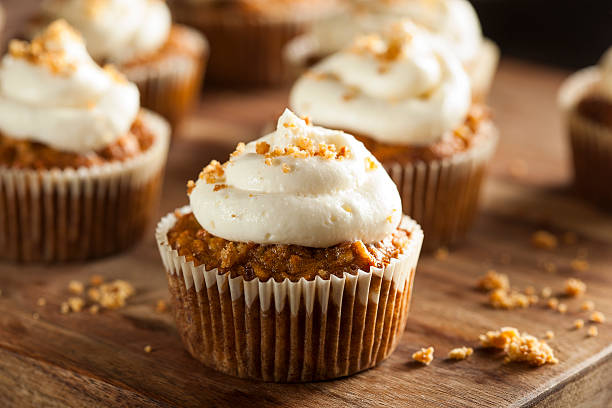 Homemade Carrot Cupcakes with Cream Cheese Frosting Homemade Carrot Cupcakes with Cream Cheese Frosting for Easter carrot cake stock pictures, royalty-free photos & images