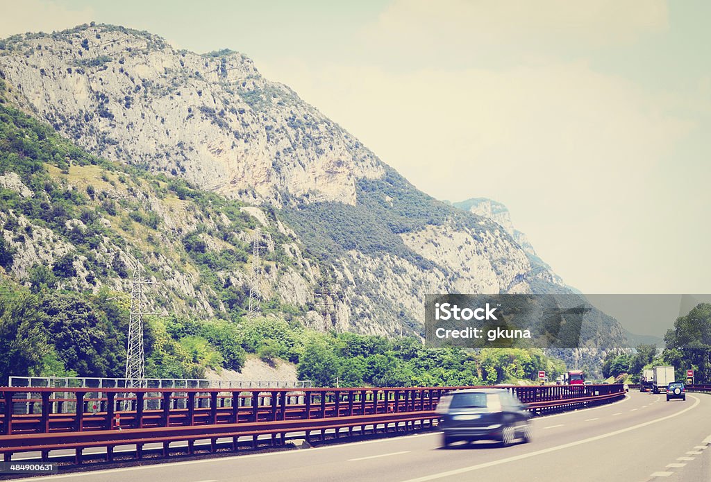 Traffic Traffic on a Modern Highway in the Italian Alps, Instagram Effect Asphalt Stock Photo