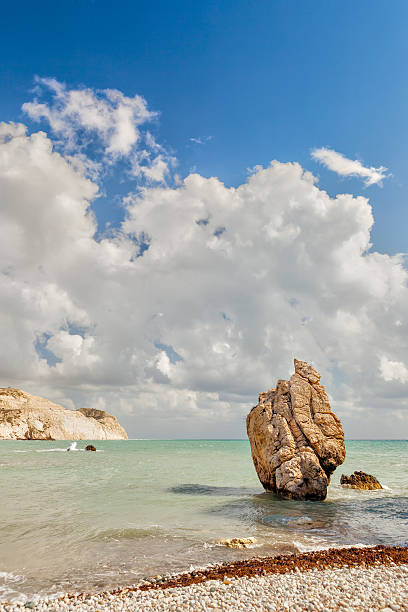 Natural rock bridge above open water; open Mediterranean Sea behind