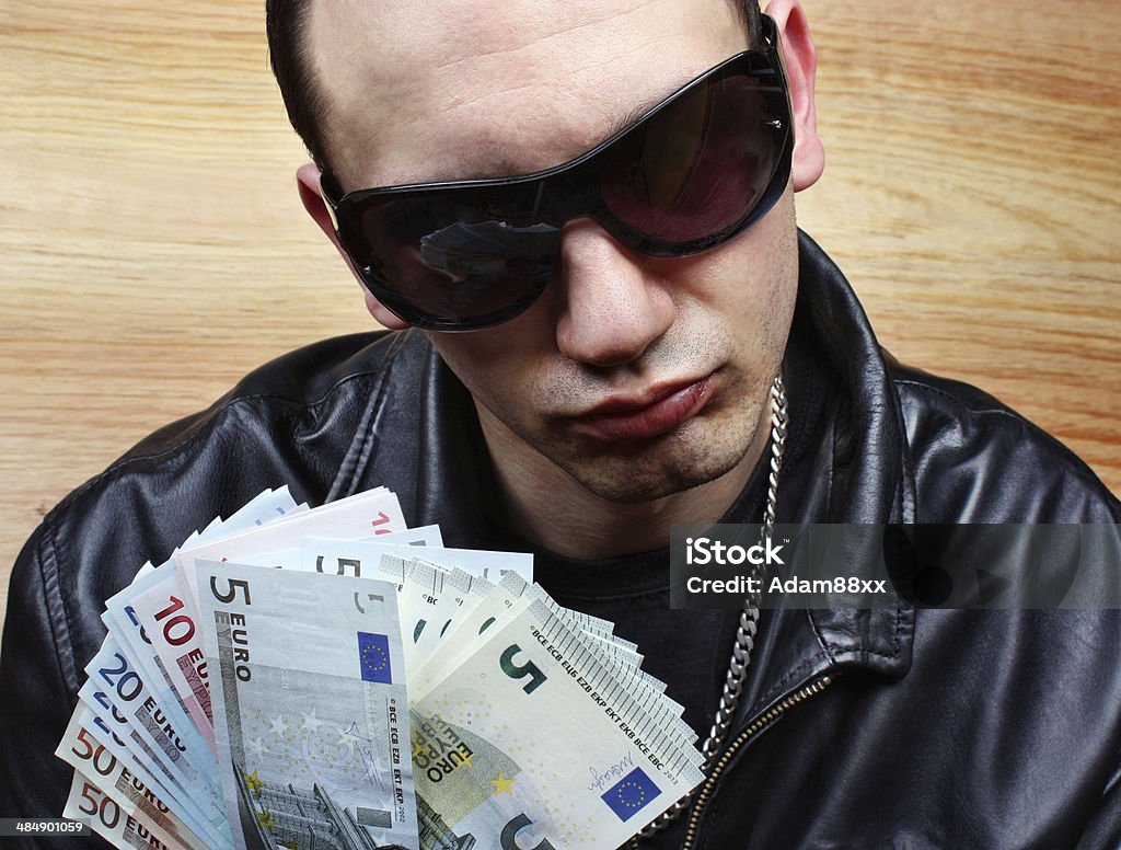 Chief mafia gangster Chief boss mafia gangster thug with stolen money euro Bossy Stock Photo