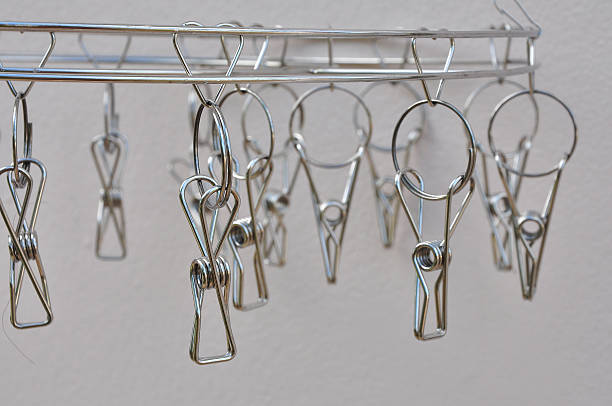 istock Hanging clothespins from stainless steel 484901318