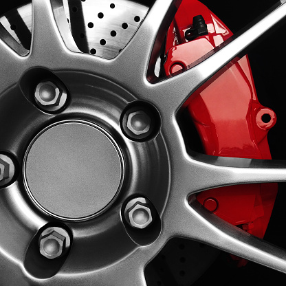 Sports car rims with red brake calipers