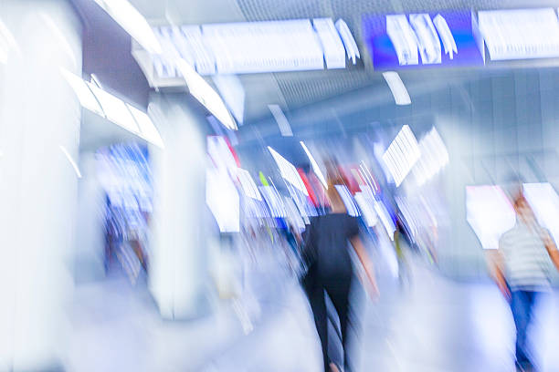 istock Motion blurred people walking in subway station. 484901716