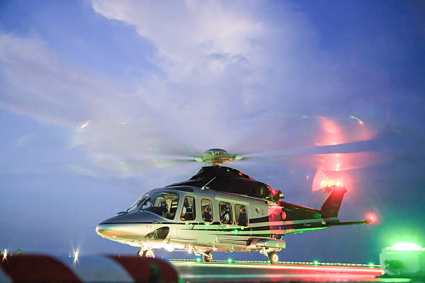 istock helicopter parking landing on offshore platform. Helicopter transfer crews 484901780