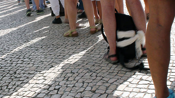 istock Foot Of People Queuing And Waiting Patiently 484902242