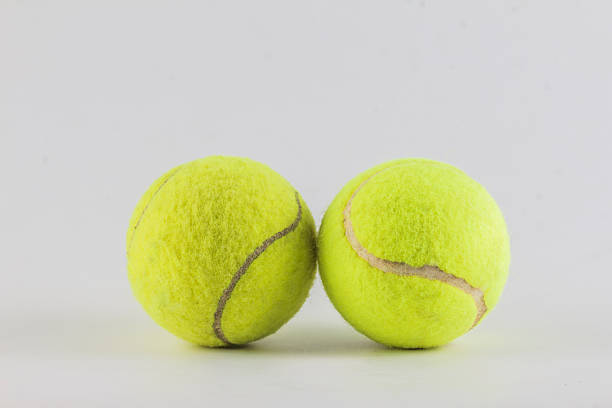 istock tennis balls isolated on white background 484906052