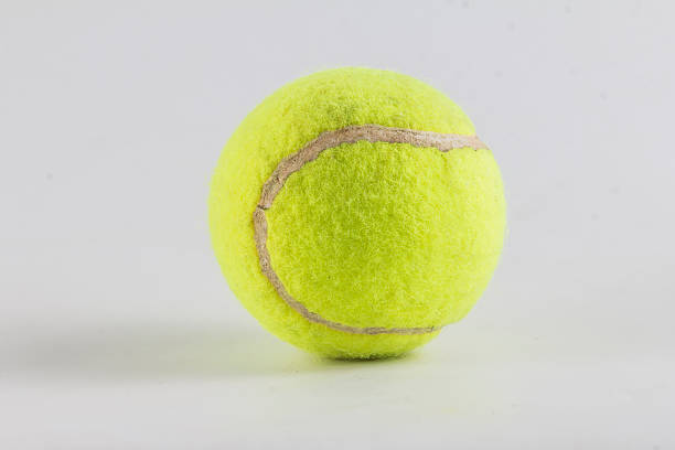 istock Single tennis ball isolated on white background 484906054