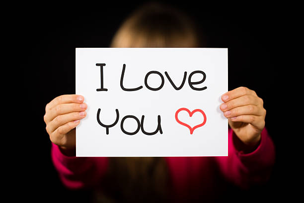 istock Child holding I Love You sign 484909436