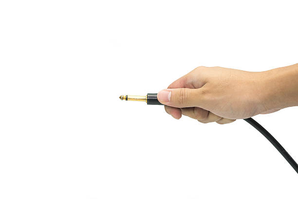 istock holds mono jack for electroguitar in the hand 1 484915546